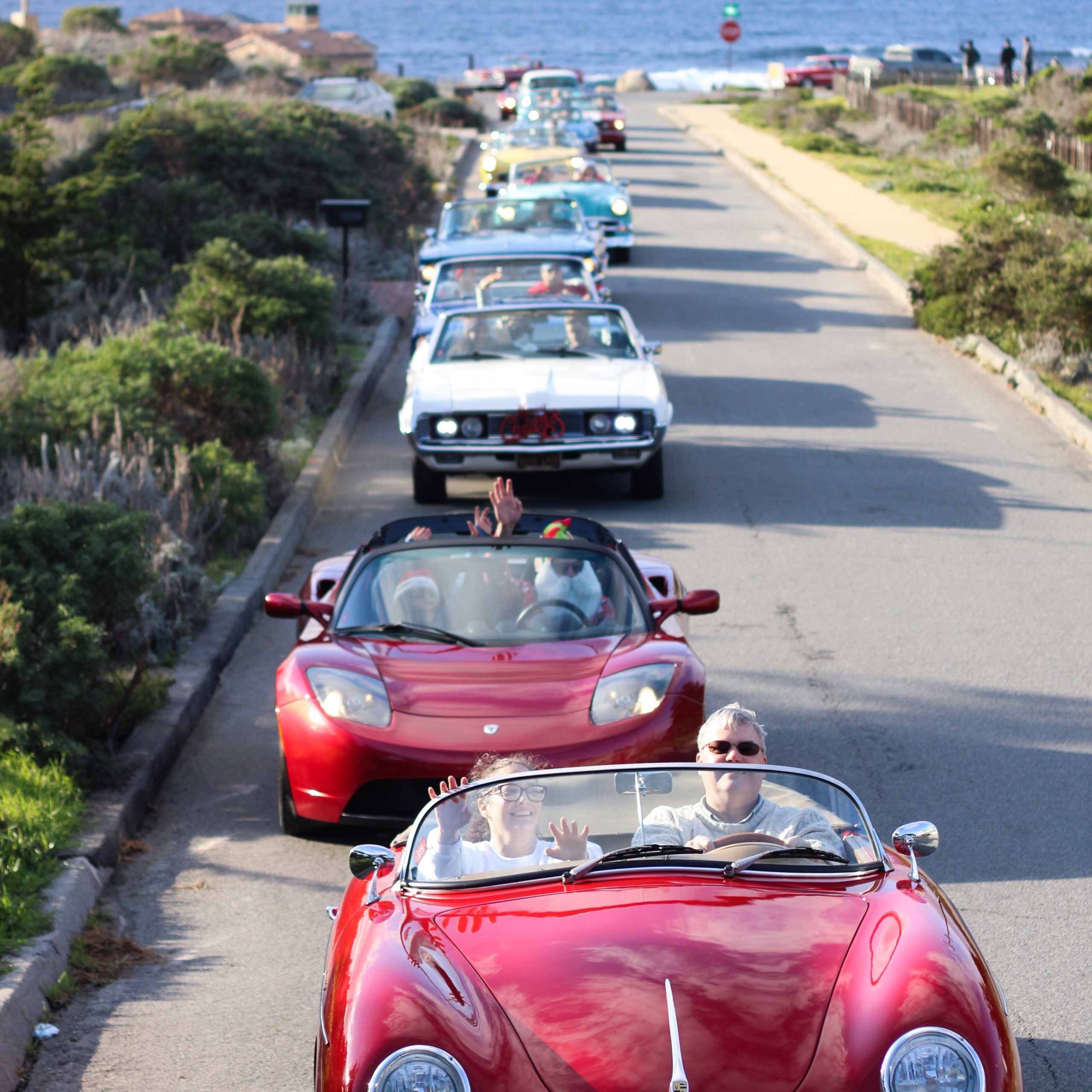 couple in classic car on road rally